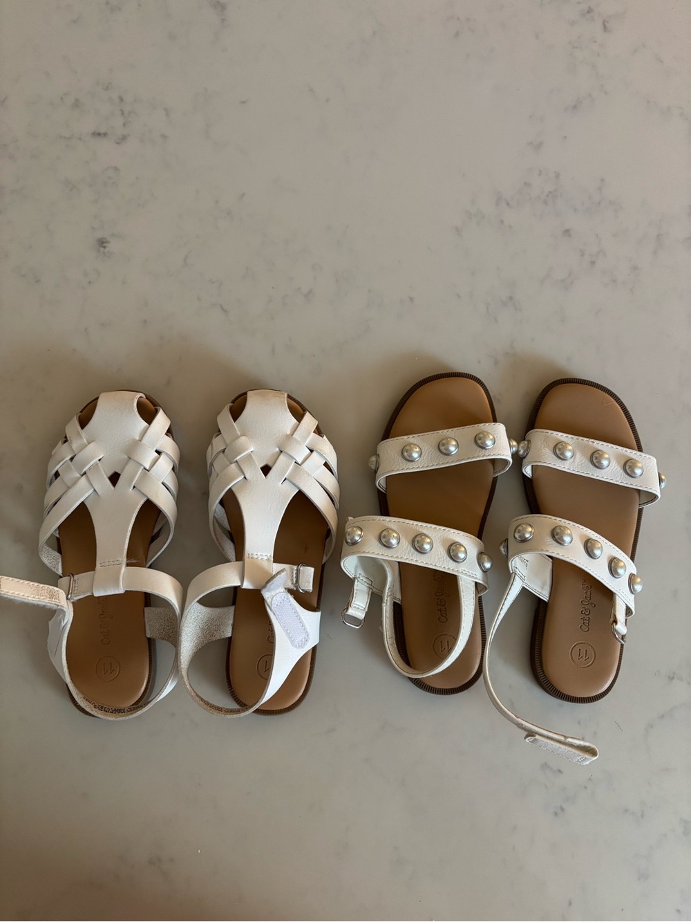 Two pairs white kids sandals